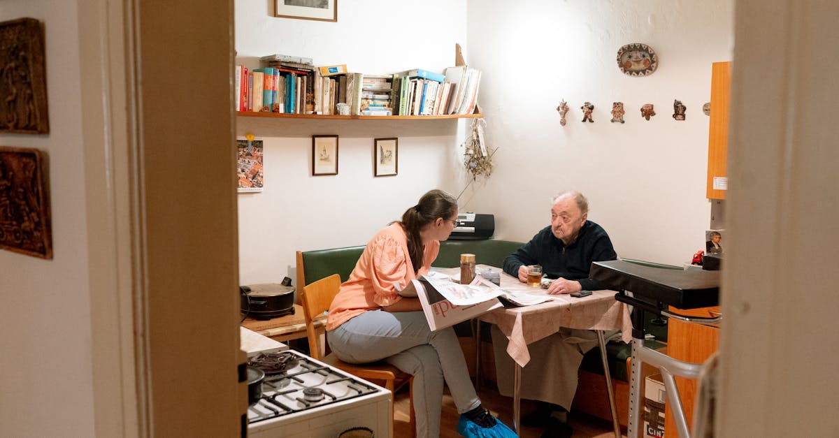 Warm scene of a caregiver and senior having a friendly conversation over coffee in Prague.